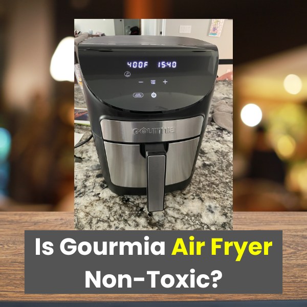 A Gourmia air fryer placed on a kitchen countertop with a digital display showing 400°F and 15:40, with the text overlay 'Is Gourmia Air Fryer Non-Toxic?' in bold white and yellow font. | Is Gourmia air fryer non toxic?